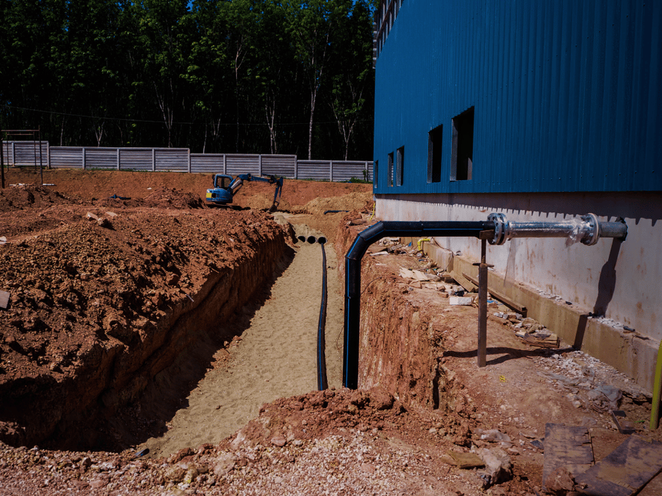 the-weeping-tile-is-going-into-the-trench-and-being-buried-with-rock