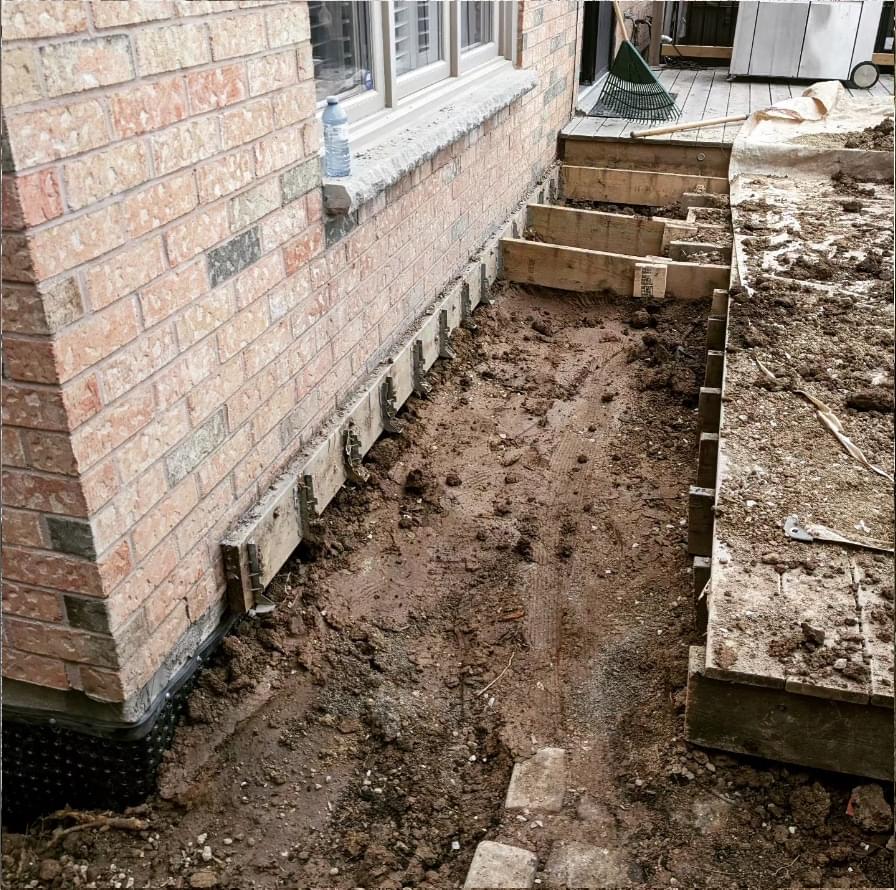 hand-excavated-exterior-waterproofing,-window-well-installation-and-deck-removal-oakville